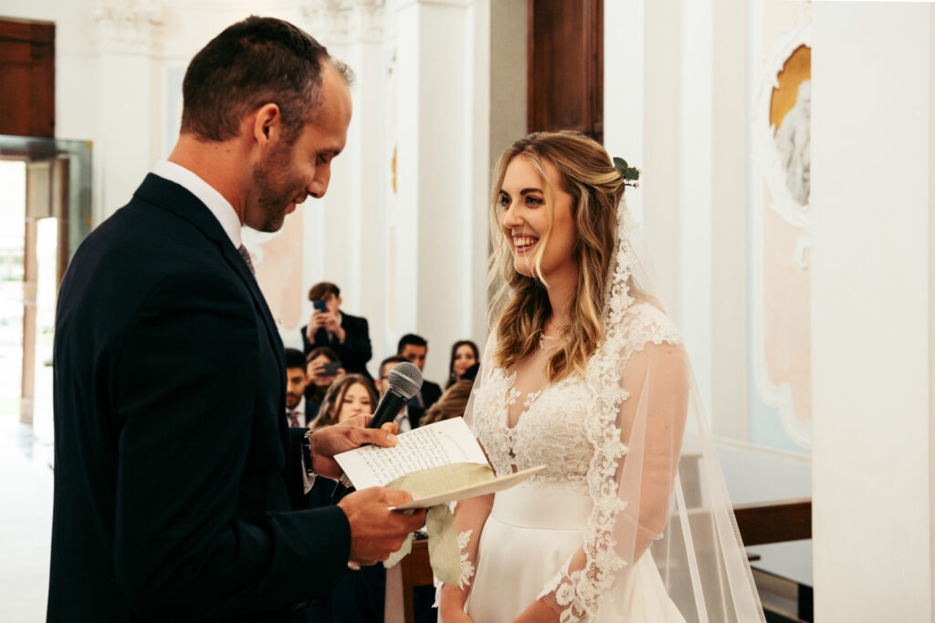 Groom reading his vows to the bride during their emotional micro-weddingeremony in Italy.