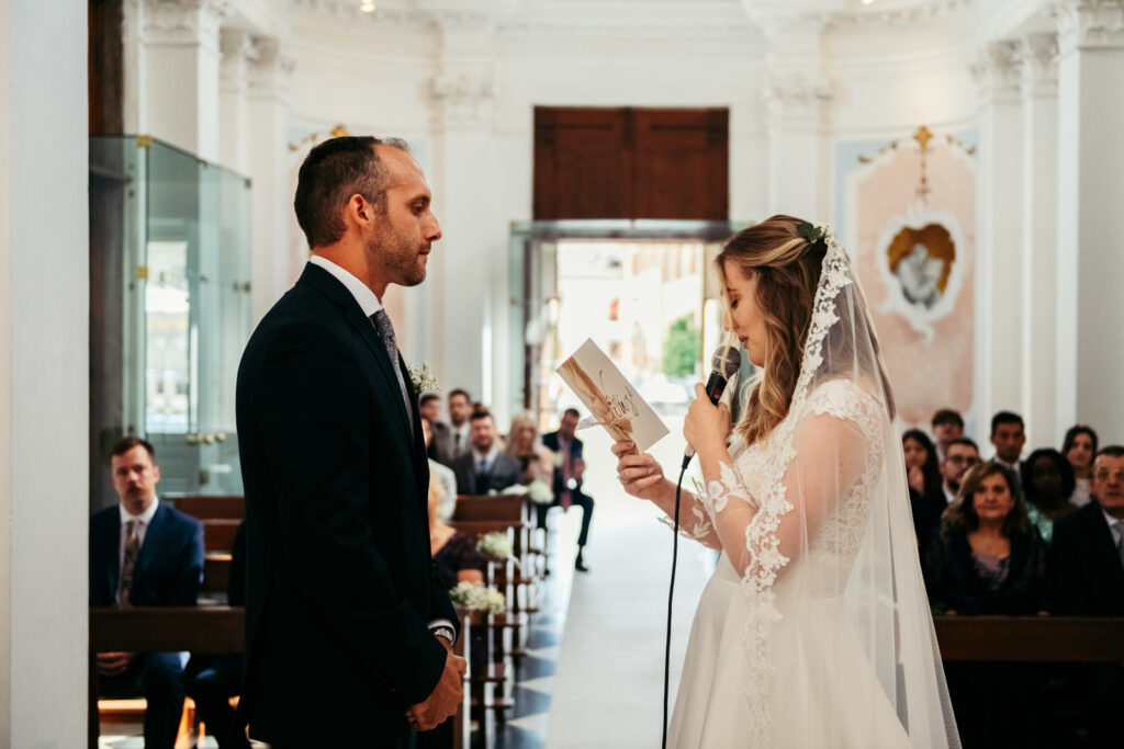 Bride reading her vows to the groom during their intimate micro-wedding in Italy.