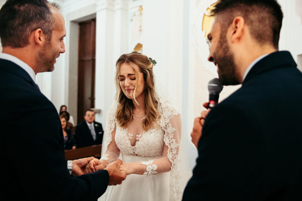 Bride crying from emotion after the ring exchange