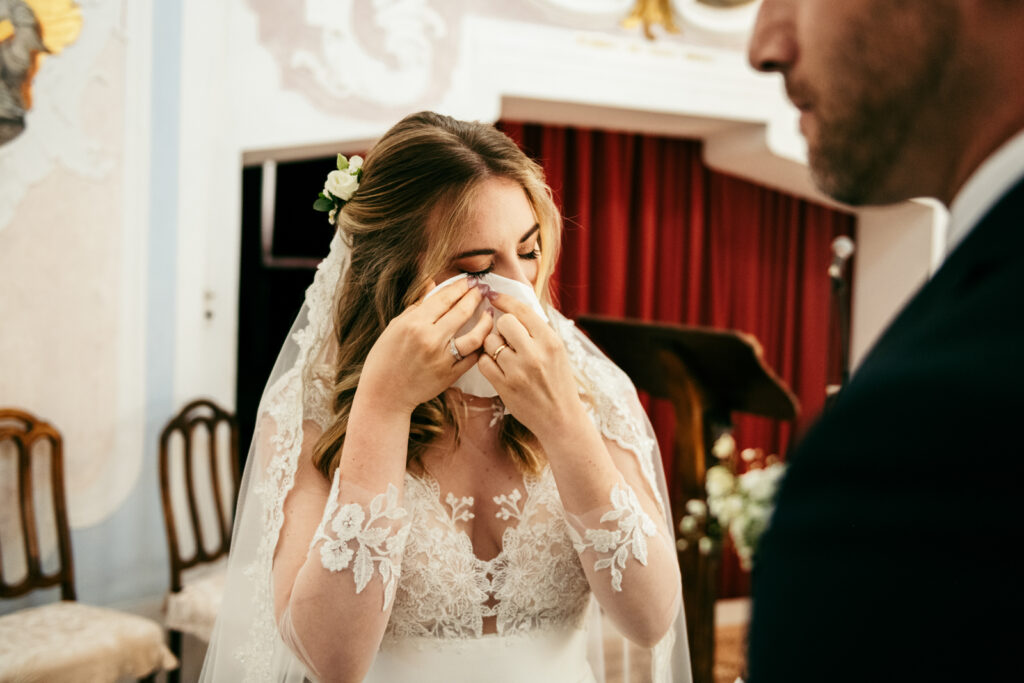 Bride visibly emotional during the ceremony at this Italy micro-wedding.