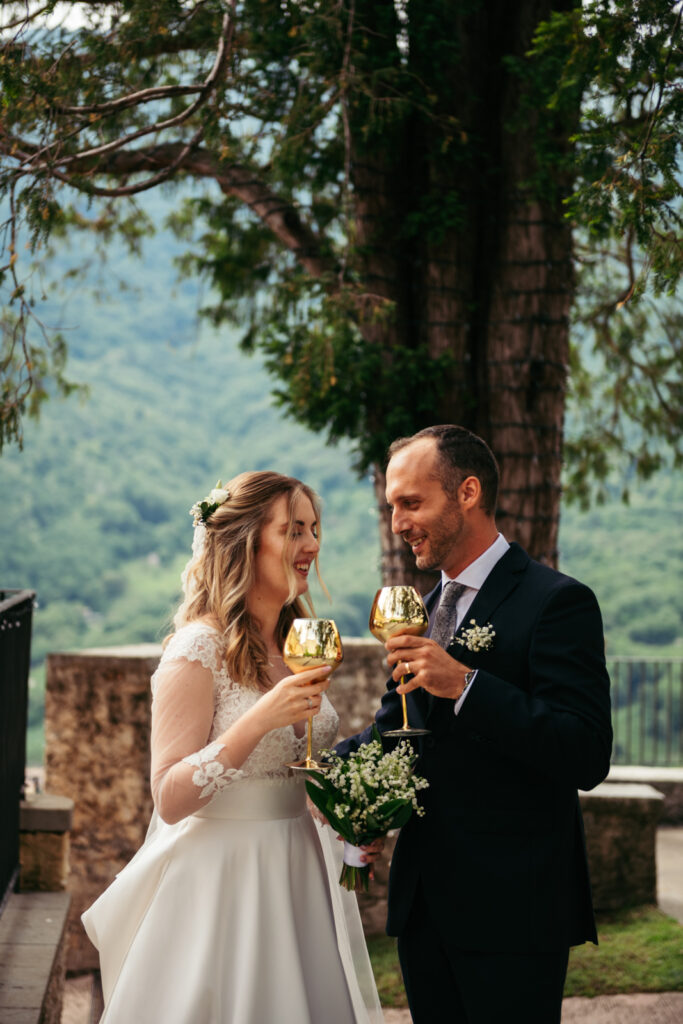 Bride and groom toasting during the reception at CastelBrando