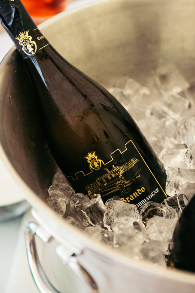Local Prosecco bottle in ice, signature touch of a Prosecco Hills wedding celebration.