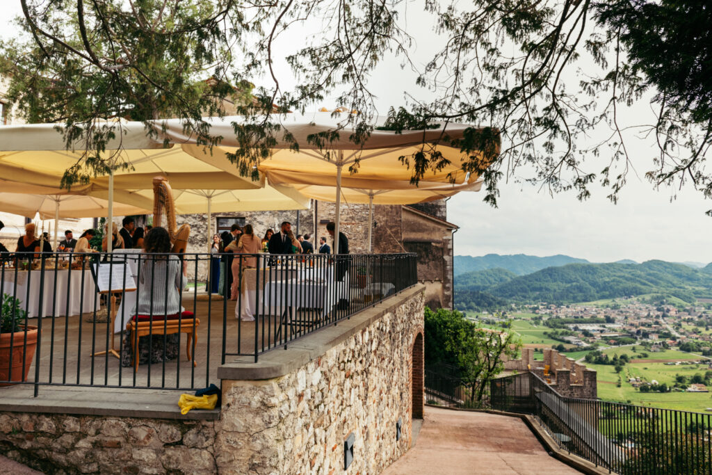 Outdoor reception at CastelBrando with sweeping views of the vineyards.