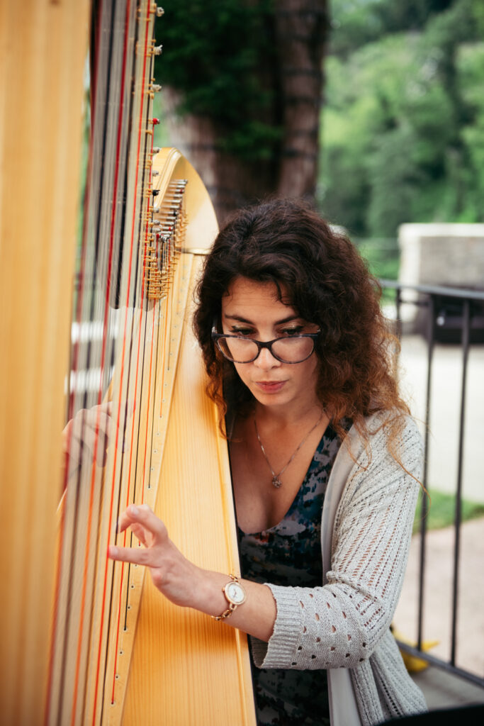 Wedding harpist playing during the ceremony