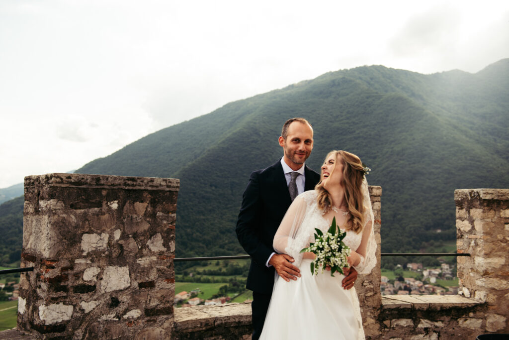 Couple enjoying the view from CastelBrando after their Italy micro-wedding ceremony.