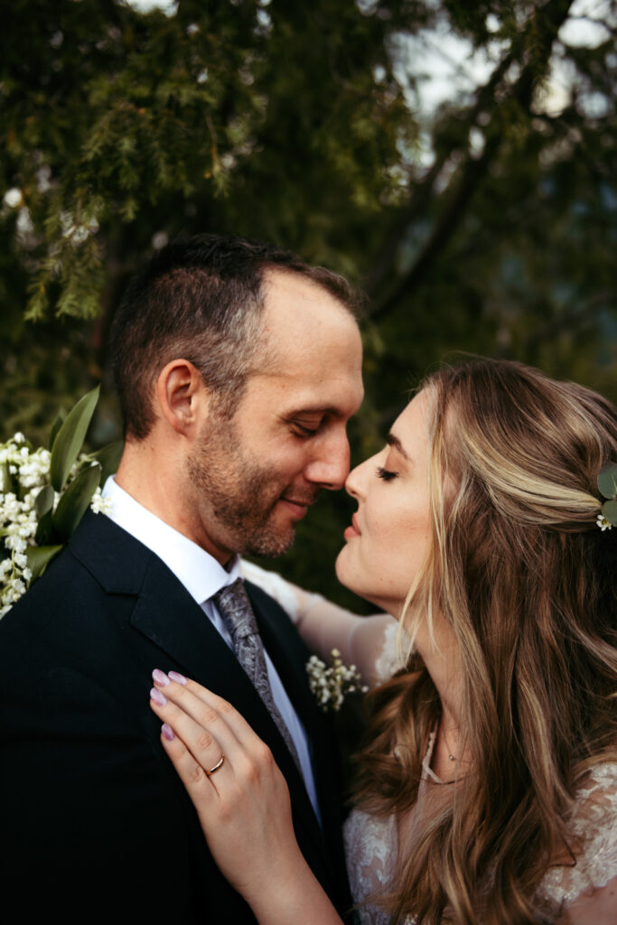 Joyful, intimate couple moment under the trees of CastelBrando.