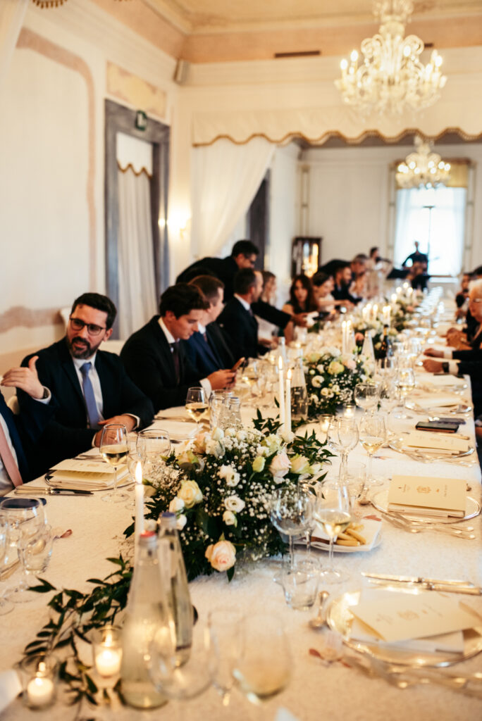 Elegant wedding reception table with floral centerpiece at this Italy micro-wedding.