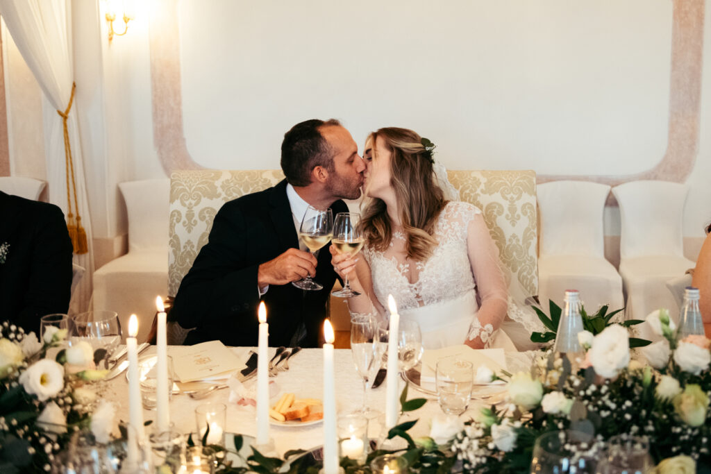 Romantic moment during the candlelit dinner at this castle micro-wedding in Italy.
