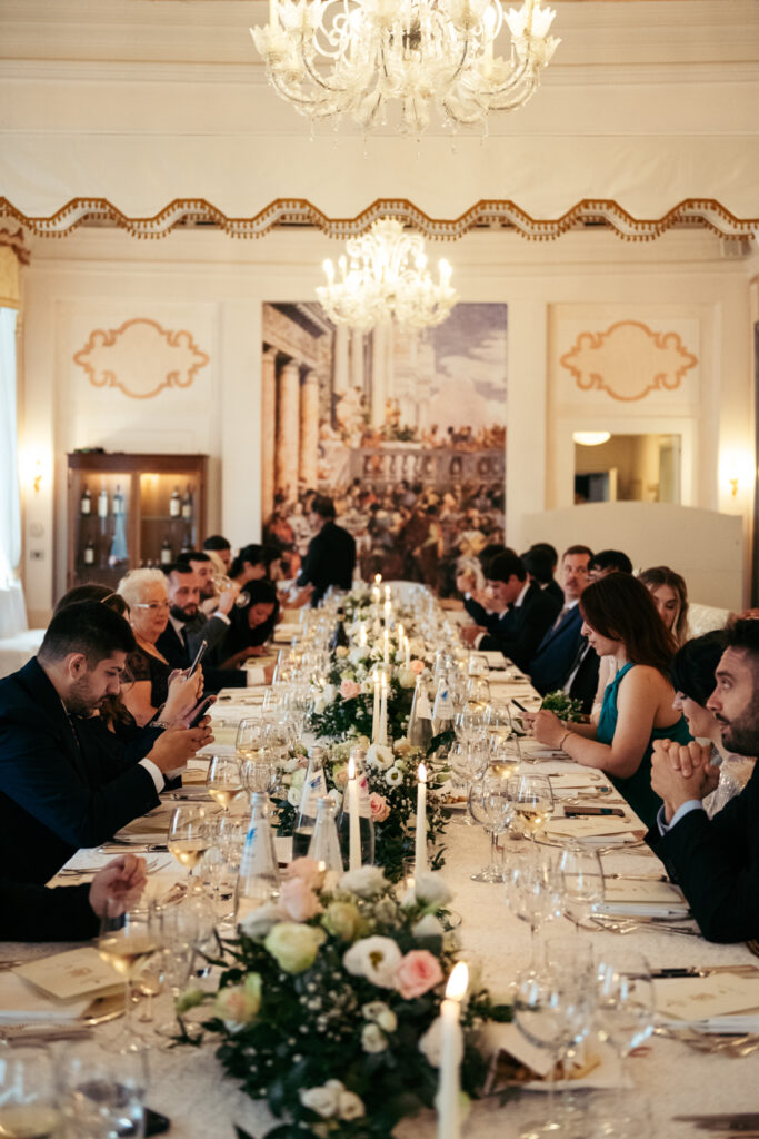 Guests enjoying the wedding reception at CastelBrando, a perfect venue for Italy destination weddings.