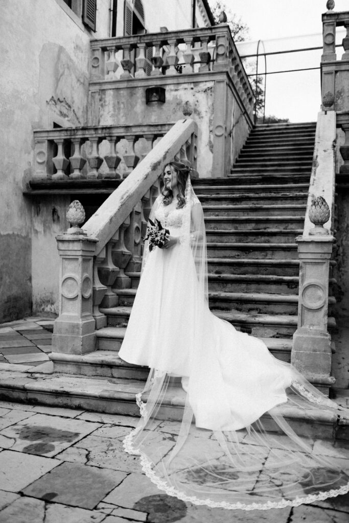 Black and White portrait of a bride on the stairs of CastelBrando