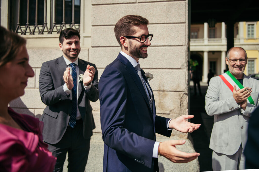 Groom smiling as he sees the bride for the first time