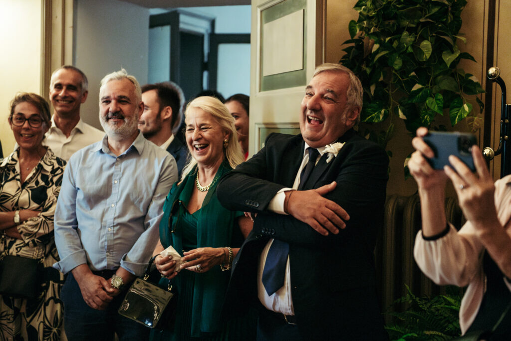 Family members reacting with joy during the wedding ceremony
