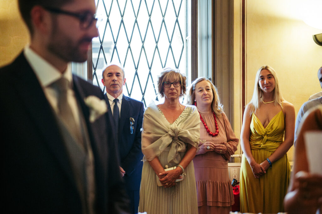Family members looking on with emotion during the civil ceremony