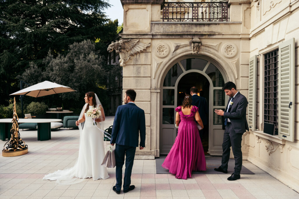 Bride and guests outside the entrance of Villa Elena