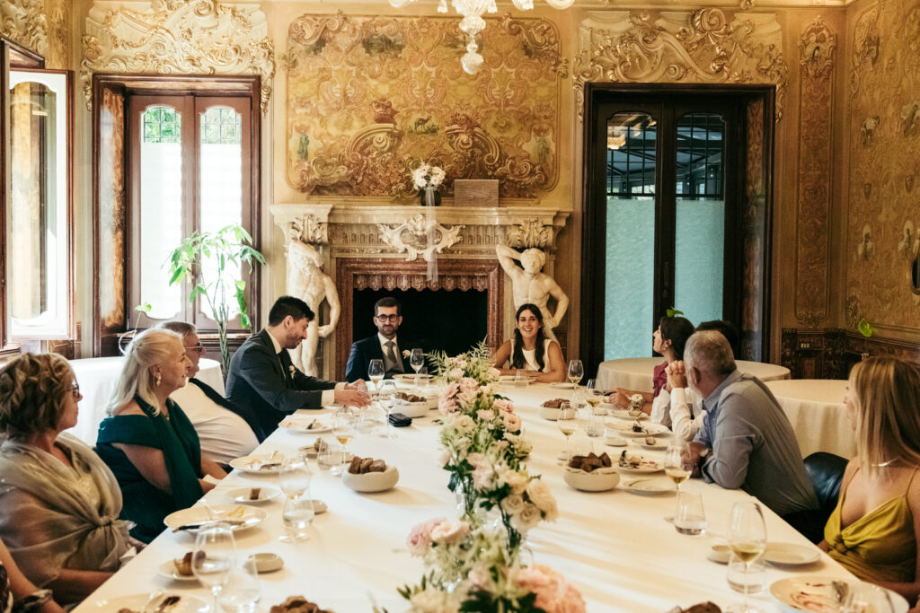 Long reception table set for a refined Italian wedding lunch