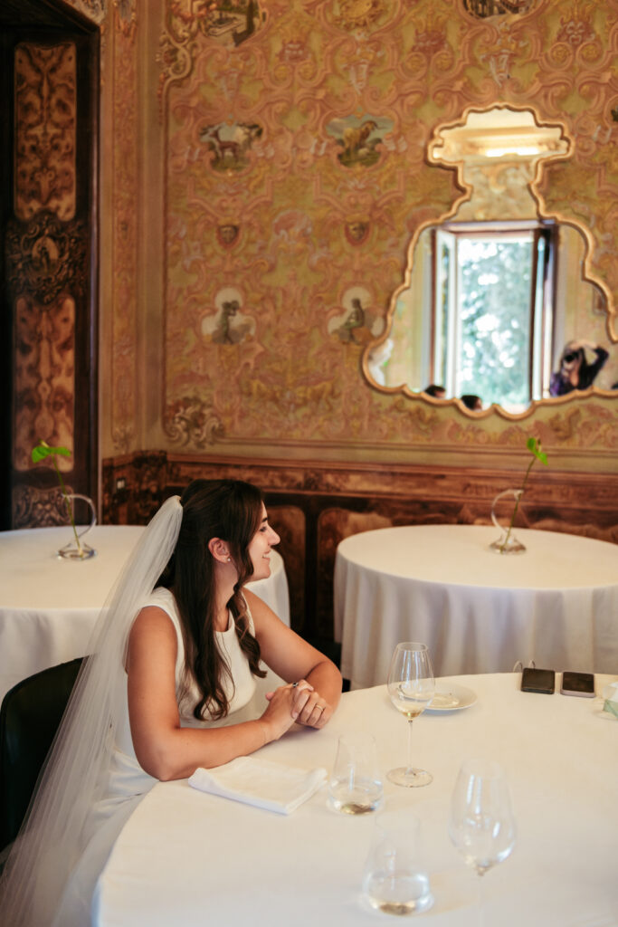 Bride enjoying a quiet moment during the elegant villa reception