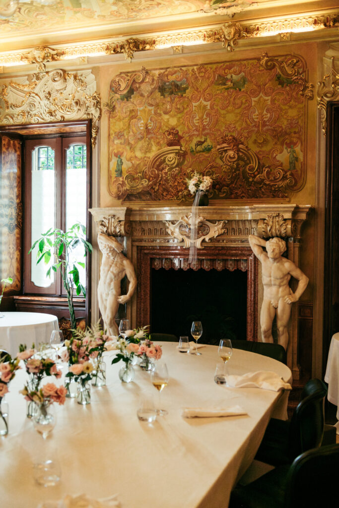 Reception table setup inside the ornate interior of the Italian villa wedding location