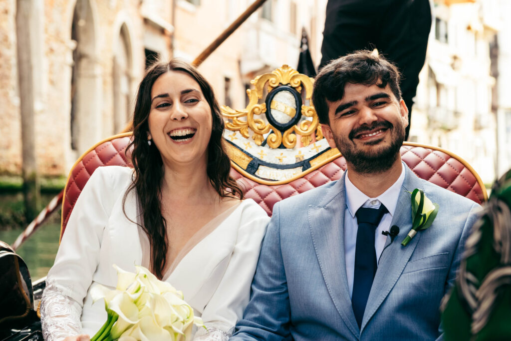 Candid moment as couple laughs during emotional vow exchange in Venice