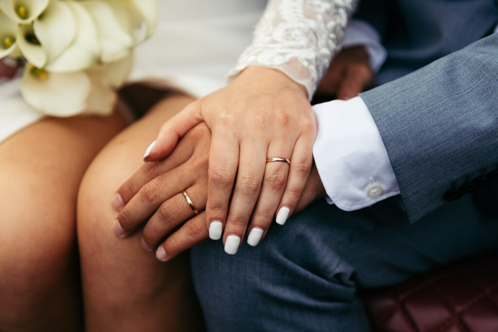 Close-up of wedding rings after a symbolic wedding in Venice aboard a gondola