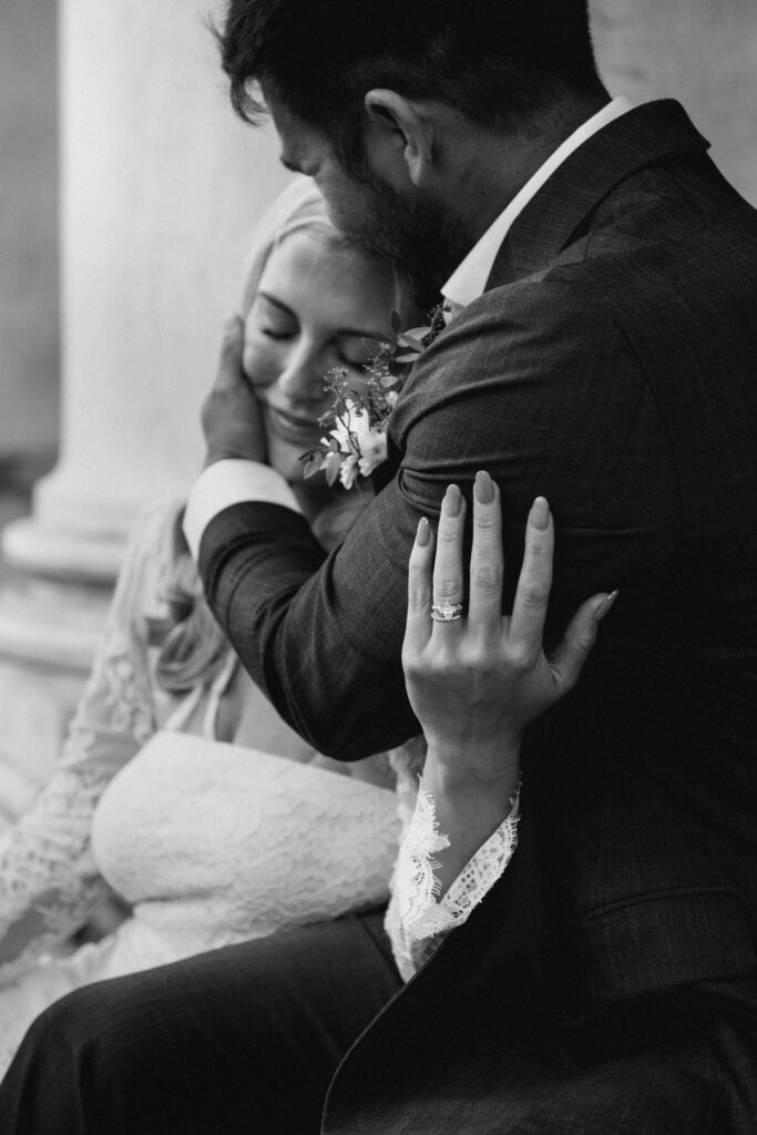 Bride leaning on groom’s chest in a quiet, emotional moment during their Venice elopement