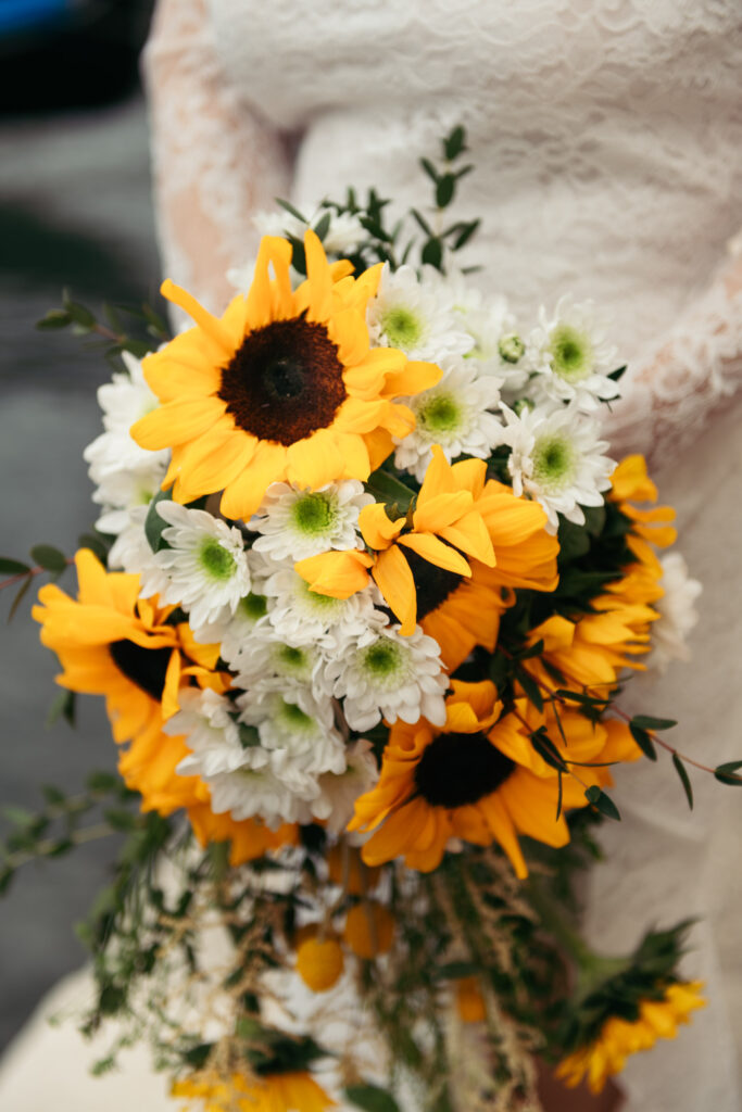 Close-up of sunflower and daisy bouquet during elope in Venice session